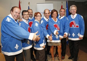 QuebecTories Quebec Conservative MPs wear Quebec Nordique jerseys during a caucus meeting in Quebec City on Wednesday, Sept. 8, 2010. The MPs wore the jerseys to support the construction of a new arena. A march will be held Oct. 2, 2010 in support for the return of the Nordiques.
